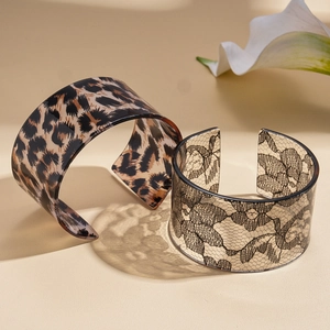 Acrylic leopard print and lace pattern open bangles in a vintage geometric style