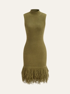 Detail view of olive green knit dress featuring high neck and long fringe tassel hemline