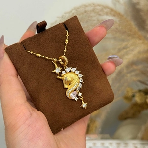 18k gold plated unicorn necklace with pink and white cubic zirconia and star charms