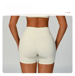 Detail view of high-waisted fitness shorts with V-shaped back seams to enhance booty shape
