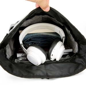 Large capacity waterproof travel backpack showing spacious interior storage with clothes