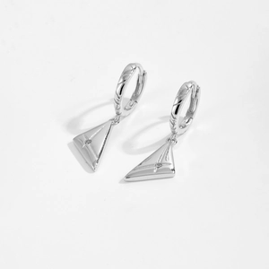 Macro detail of S925 silver triangle earrings with micro-set cubic zirconia accents