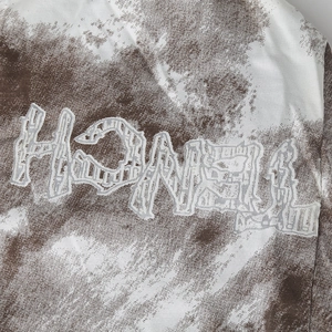 Vintage washed beanie with HONEY embroidery and retro tie-dye pattern fabric detail
