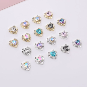 Sparkling heart-shaped nail art rhinestones with crystal accents in various vibrant colors