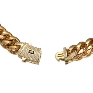 Gold Cuban link chain necklace with a square iced out rhinestone lobster clasp detail