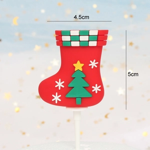 Detail view of a red Christmas stocking cake topper with 3D tree and star patterns