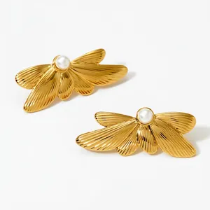 Elegant gold butterfly wing earrings with white pearl accent in polished stainless steel