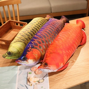 Detailed view of realistic plush dragon fish pillows in colorful scale textures