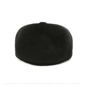 Rear view of men's winter flat top hat featuring plush black faux fur material