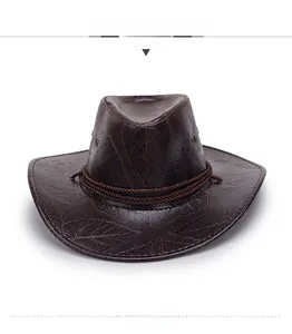Close-up of deep brown straw cowboy hat with embossed leaf patterns and braided rope band