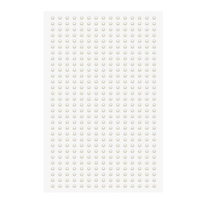 Close-up of organized rows of creamy white DIY pearl stickers for craft decoration