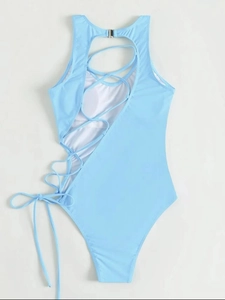 Detailed back view of light blue swimsuit with cut-out design and lace-up side detail