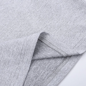 Macro detail of high-quality double-stitch sewing on gray marl knit yoga wear hem