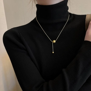Minimalist gold titanium steel necklace featuring a sleek ball and vertical bar pendant