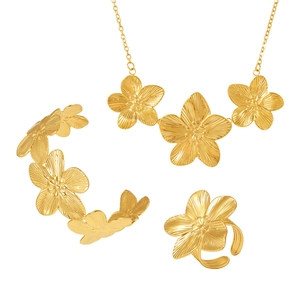 Golden flower jewelry set including necklace, bracelet and ring with textured petals