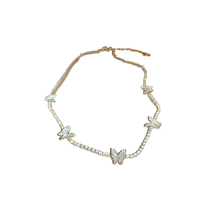 Elegant gold butterfly necklace with shimmering rhinestones on a minimalist chain