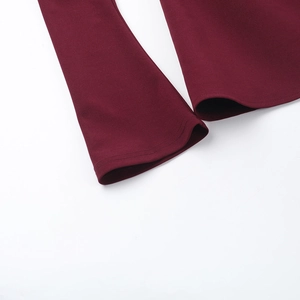 Close-up of wine red long sleeve dress showing high-quality double-needle stitching details
