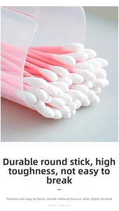 Detail of pink plastic double-headed cotton swabs with soft tips in a clear storage box