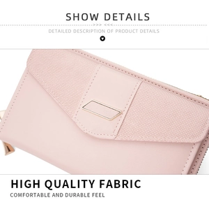 Detail showing the pink litchi grain texture and smooth leather stitching on the phone bag
