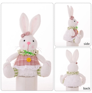 Three-sided view showing side and back of a glowing Easter bunny doll in pink plaid dress