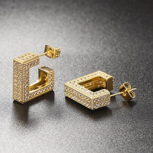 Macro shot of gold square hoop earrings with micro-paved cubic zirconia and butterfly back