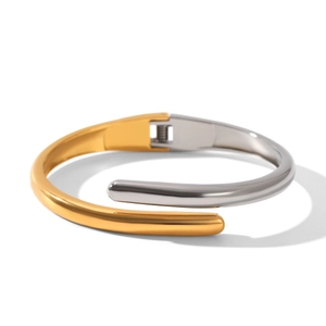 Minimalist two-tone stainless steel hinged bangle with sleek gold and silver curves