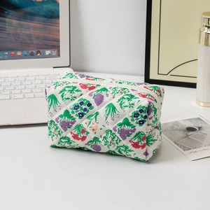 Detailed macro view of floral quilted cotton makeup bag with high-quality zipper closure
