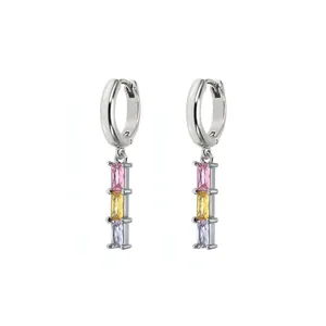 Silver geometric earrings with vertical pink yellow and lilac zircon stones on white background