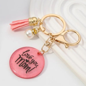 Porte-clés MOM en acrylique rose avec pompon, perle et message Love you Mom