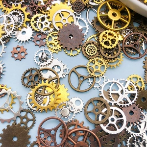 Macro view of assorted steampunk metal gears in gold and bronze on a blue background