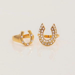 18K gold plated horseshoe open rings with white cubic zirconia on white background