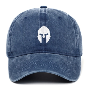 Close-up of premium washed navy cotton baseball cap with white Spartan helmet embroidery