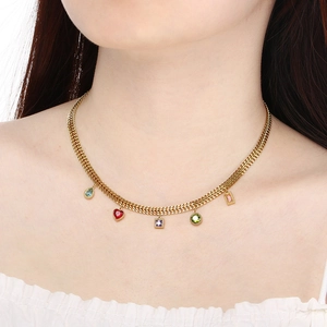 Gold woven necklace featuring five colorful multi-shaped gemstones on a female model
