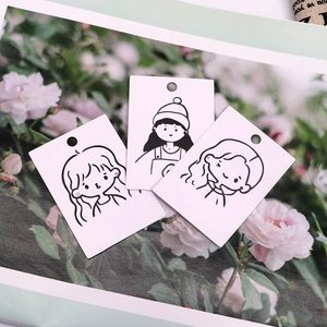 Cute girl earring display cards with black and white cartoon illustration on white paper