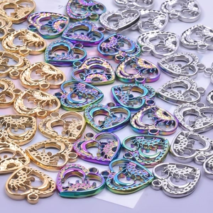 Stainless steel heart pendant with moon and star engraving in gold silver and rainbow colors
