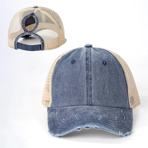 Detail of denim trucker hat with distressed holes and crisscross ponytail elastic band