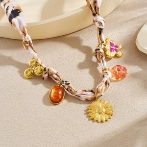 Fashionable leopard ribbon necklace with golden sunflower and butterfly charms