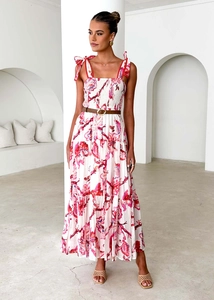 Detail of floral maxi dress with smocked waist, bow straps and layered ruffle hem