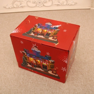 Detailed view of a red Christmas gift box with sweet treats and ice cream illustrations