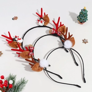 Detailed view of three plush Christmas reindeer antlers headbands with festive holiday props