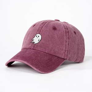 Detailed view of white ghost embroidery on burgundy washed cotton baseball cap