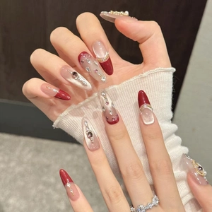 Handmade wine red cat eye press-on nails with French almond shape and 3D pearls