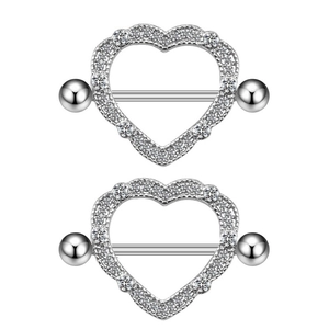 Detail of silver heart nipple rings with white zircon inlay for body piercing jewelry