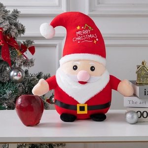 Plush Santa Claus doll with Merry Christmas embroidery amidst festive holiday decorations