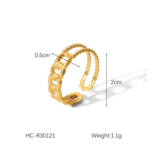 Detailed view of dual-layer gold ring showing chain and bead textures with measurements