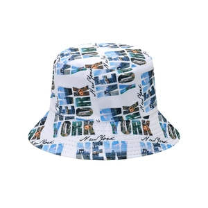 White canvas bucket hat with New York cityscape prints and bold lettering