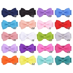 Grid display of 16 colorful grosgrain ribbon bow hair clips for girls with model numbers