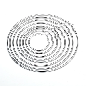 Silver hoop earrings set showing various sizes in a nested minimalist arrangement