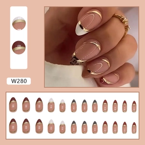 Detailed set of French style press-on nails with burgundy, leopard print and gold accents