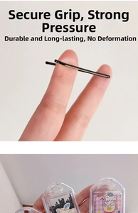 Close-up of flexible black metal bobby pins with a portable bear-themed storage box